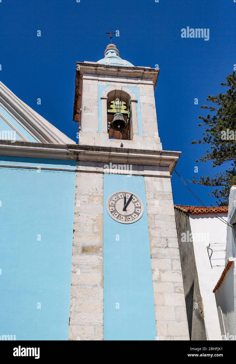 Detail of the east bell tower of the Church of Our Lady of Good Success, with its clock, in Cacilhas, Portugal, Stock Photo