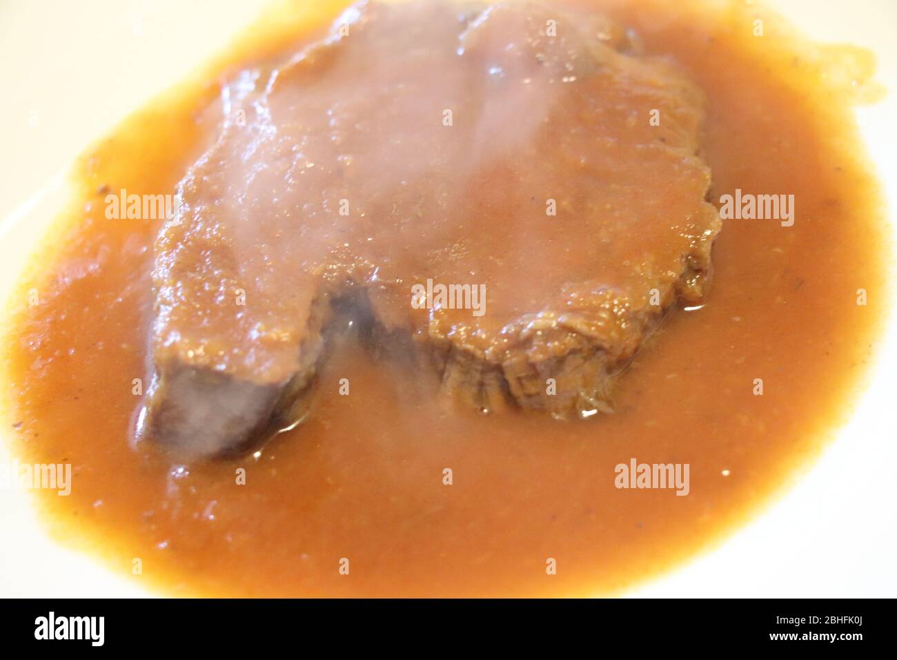 Boiled meat of veal and beef with vegetable sauce Stock Photo Alamy