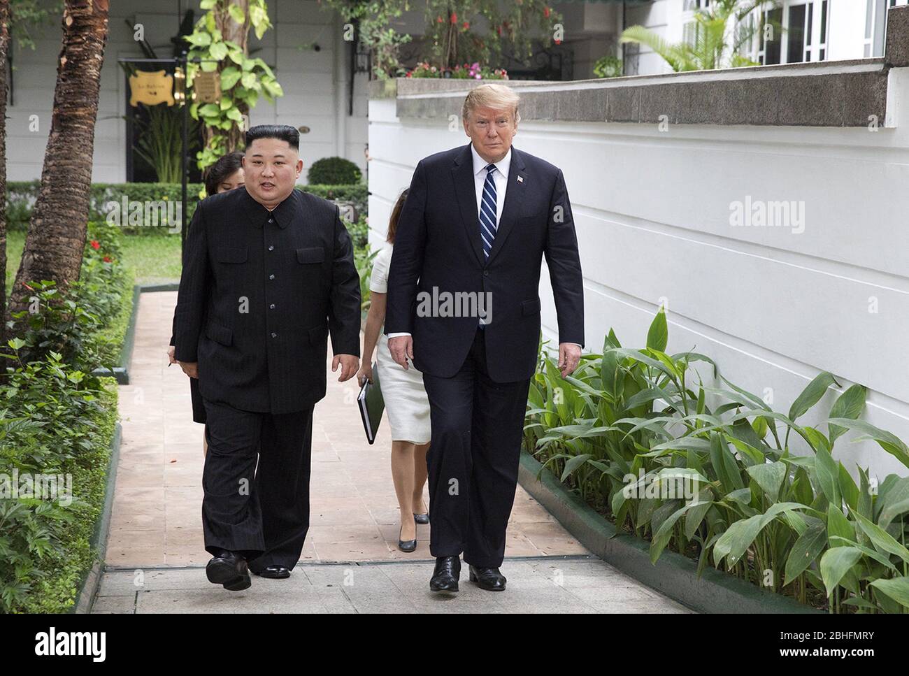 Hanoi, Vietnam. 27th Feb, 2019. President Donald J. Trump and Kim Jong Un, Chairman of the State Affairs Commission of the Democratic PeopleÕs Republic of Korea, walk together on the pool patio Thursday, Feb. 28, 2019, at the Sofitel Legend Metropole hotel in Hanoi, prior to participating in an expanded bilateral meeting. People: President Donald Trump, Kim Jong Un Credit: Storms Media Group/Alamy Live News Stock Photo