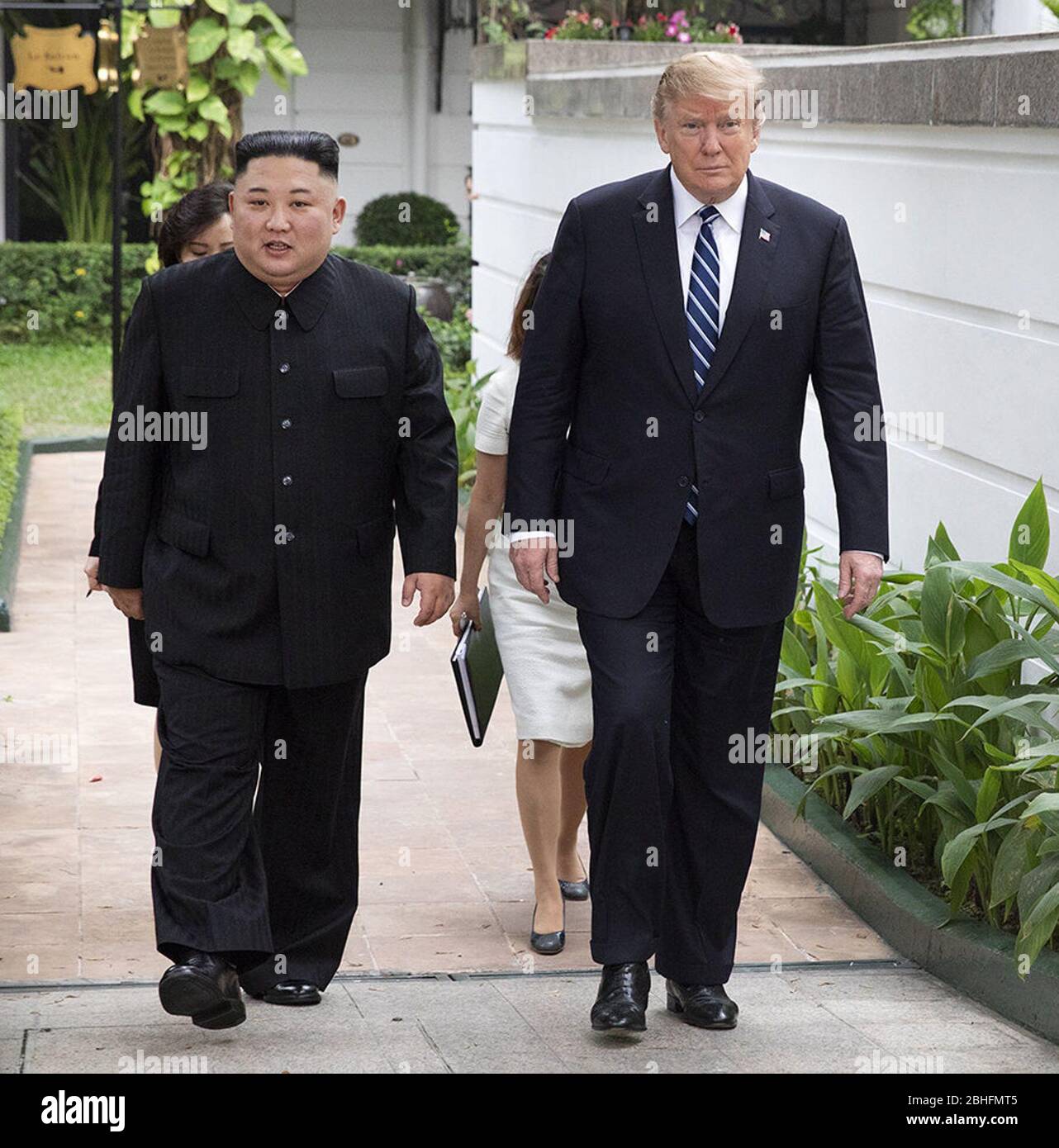 Hanoi, Vietnam. 27th Feb, 2019. President Donald J. Trump and Kim Jong Un, Chairman of the State Affairs Commission of the Democratic People's Republic of Korea, walk together on the pool patio Thursday, Feb. 28, 2019, at the Sofitel Legend Metropole hotel in Hanoi, prior to participating in an expanded bilateral meeting. People: President Donald Trump, Kim Jong Un Credit: Storms Media Group/Alamy Live News Stock Photo