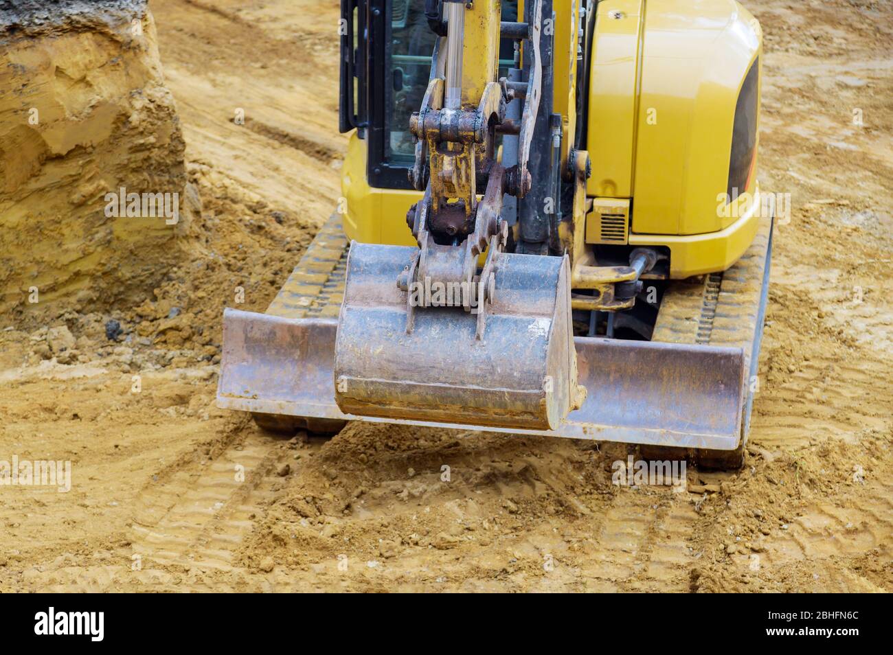 Excavator on earthwork during the foundation construction on backhoe ...