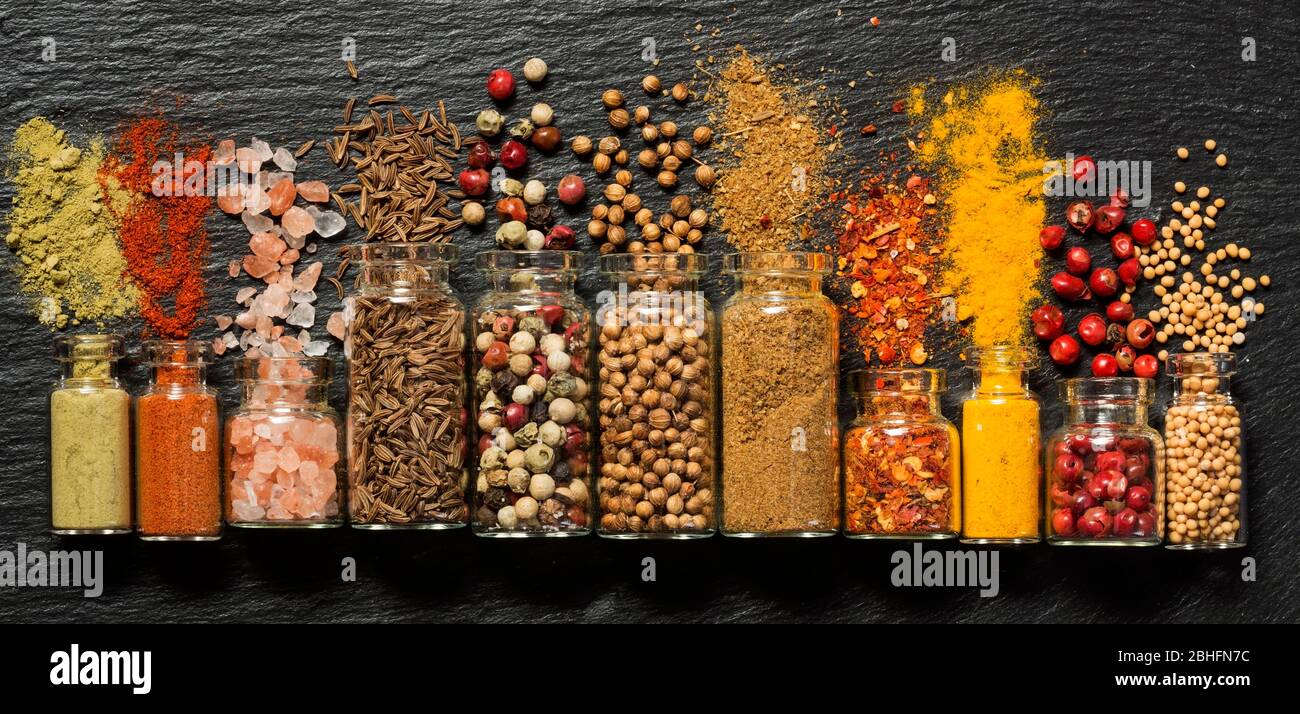 Various spices in small bottles Stock Photo Alamy