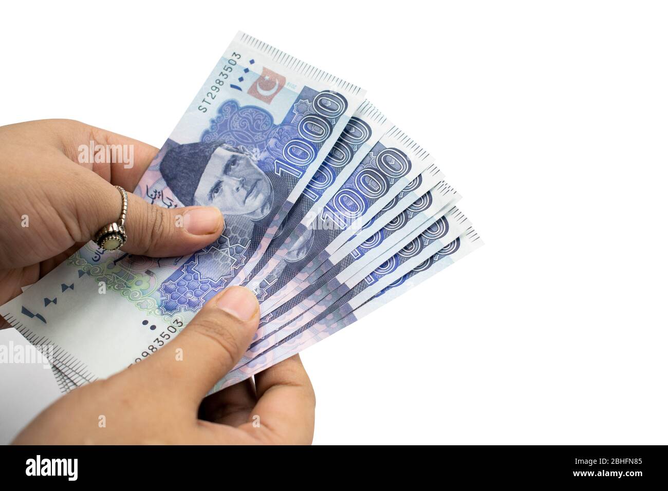 Pakistani Currency, Banknotes holding in hands, Pakistan Bank Rupees Stock Photo