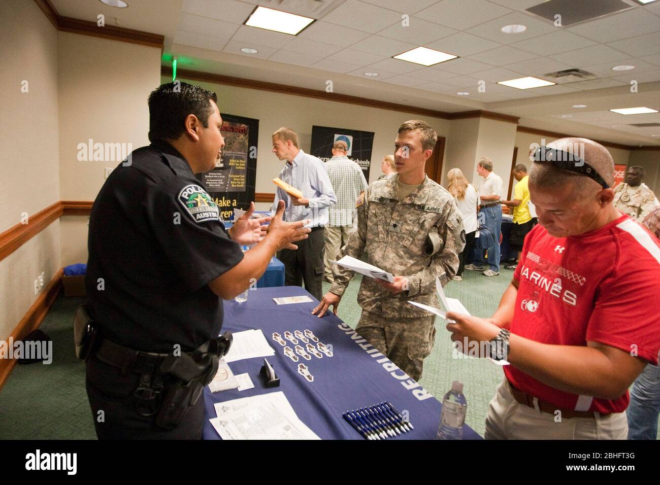 Austin Texas USA, January 2012 Police officer gives a recruiting pitch to United States
