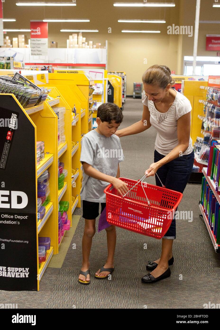 Austin Texas USA, August 2012: Hispanic mom takes her 8-year-old son shopping for third grade elementary school supplies at an office supply store in Texas. Model Released  ©Marjorie Kamys Cotera/Daemmrich Photography Stock Photo