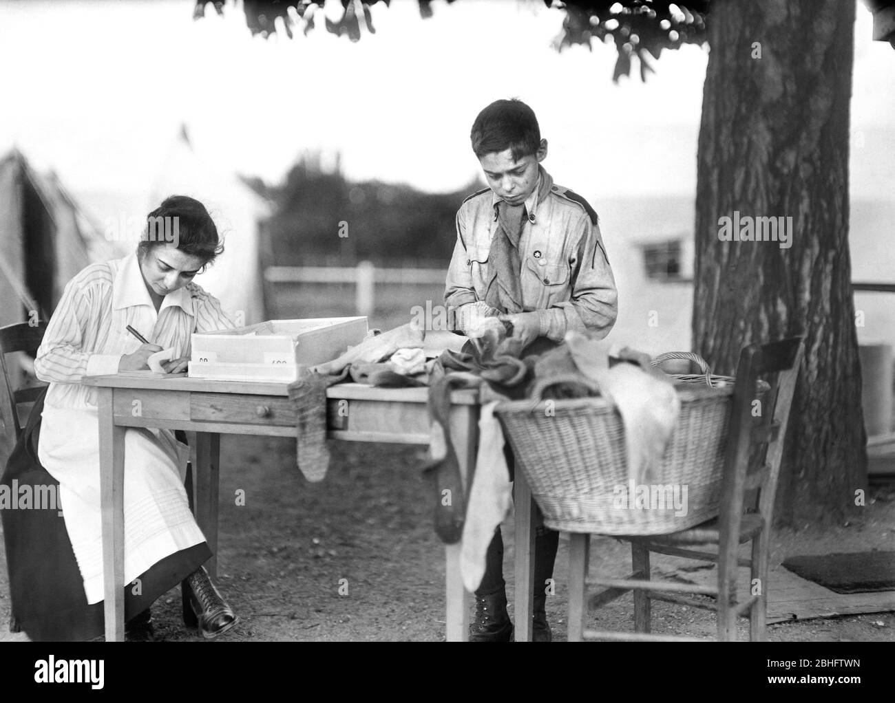 Boy Scout sorting Socks for Soldiers in Camp near Paris, France, Lewis  Wickes Hine, American National Red Cross Photograph Collection, September  1918 Stock Photo - Alamy