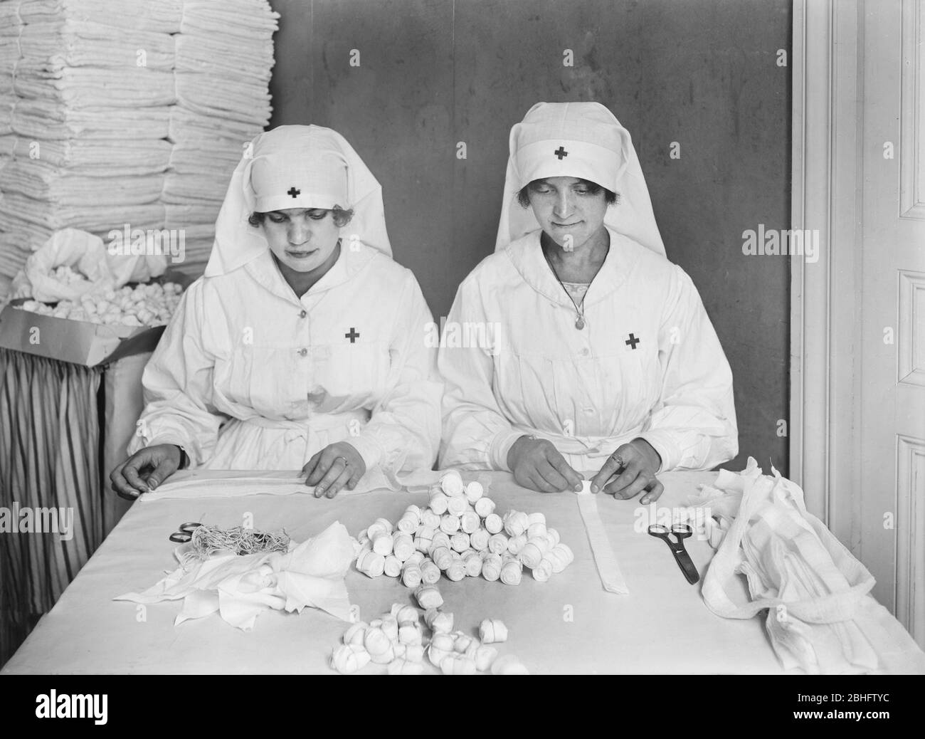 Two French Women employed by American Red Cross to mold Gauze Packing ...