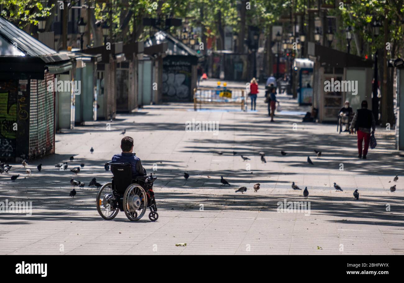 A man in a wheelchair is seen in Las Ramblas during the Covid19 pandemic.Barcelona faces the