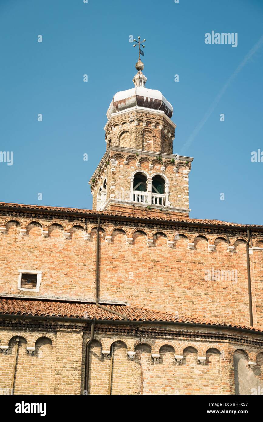 Brick bell tower of the church of San Giacomo in Murano, Venice lagoon island, Italy. Stock Photo