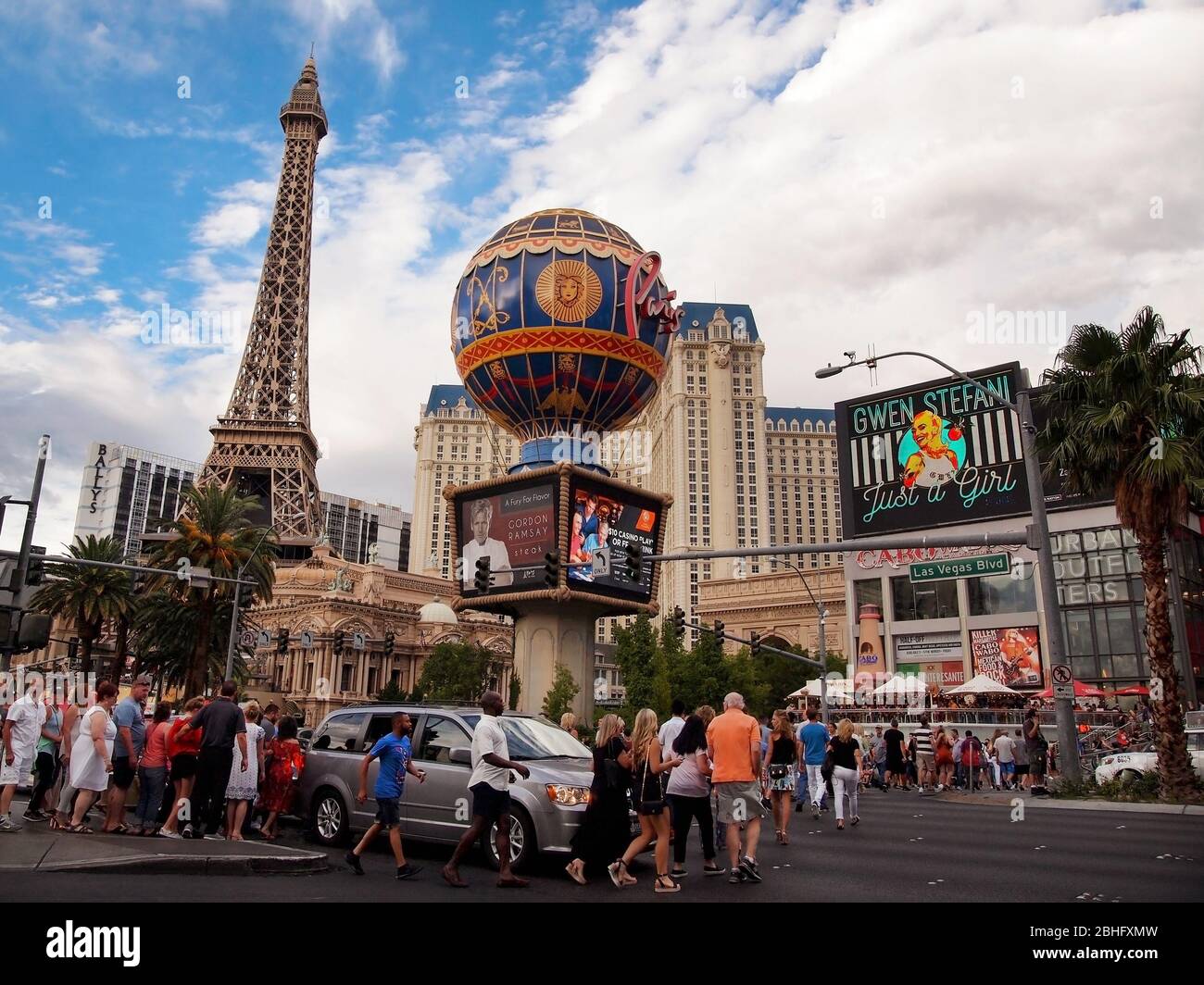 LAS VEGAS, NEVADA - JULY 21, 2018: Throngs of tourists cross Las Vegas Boulevard on a typical summer day visiting casinos, restaurants and other venue Stock Photo