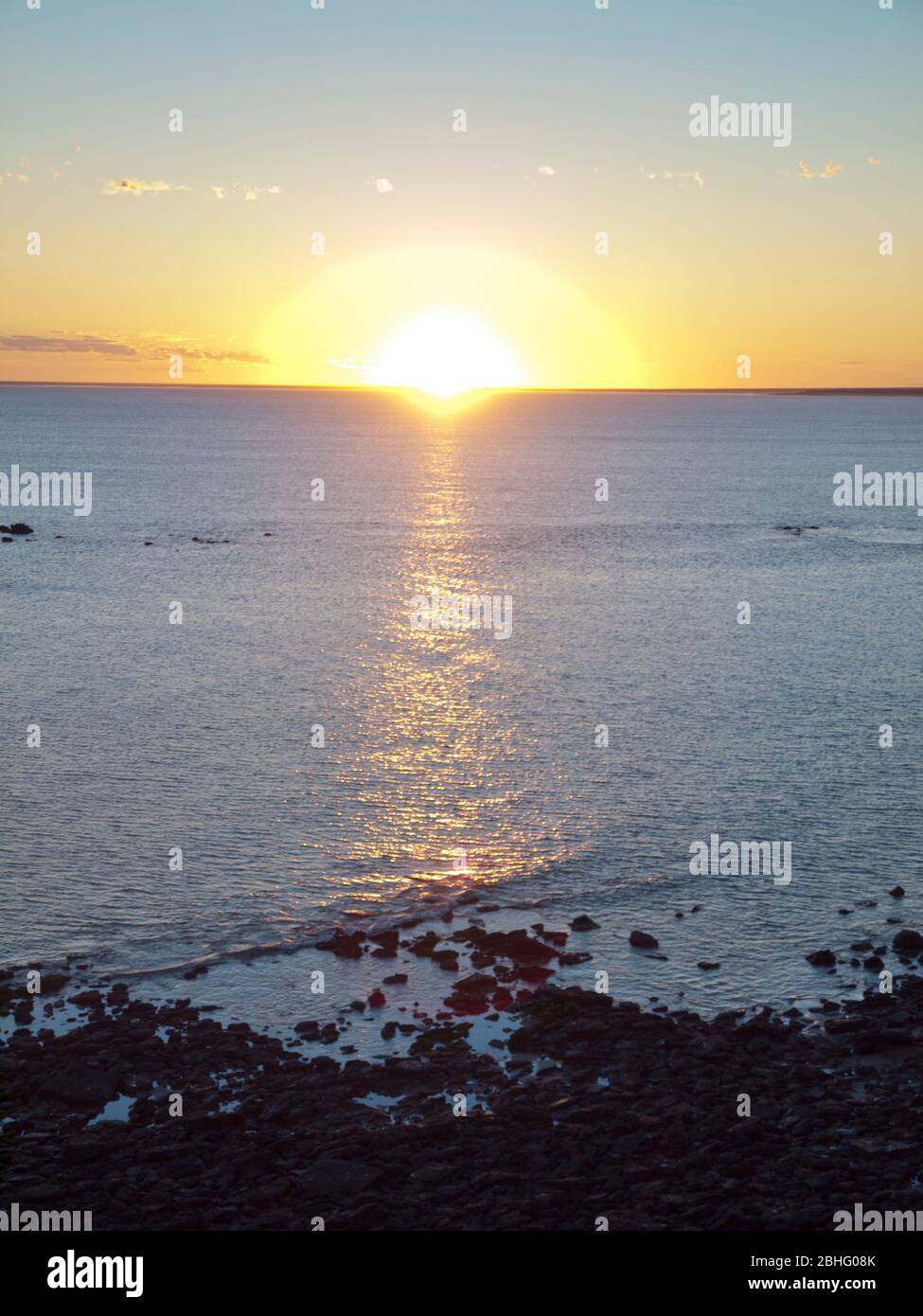 Sunrise over the Indian Ocean, Pender Bay, Dampier Peninsula, Western Australia Stock Photo