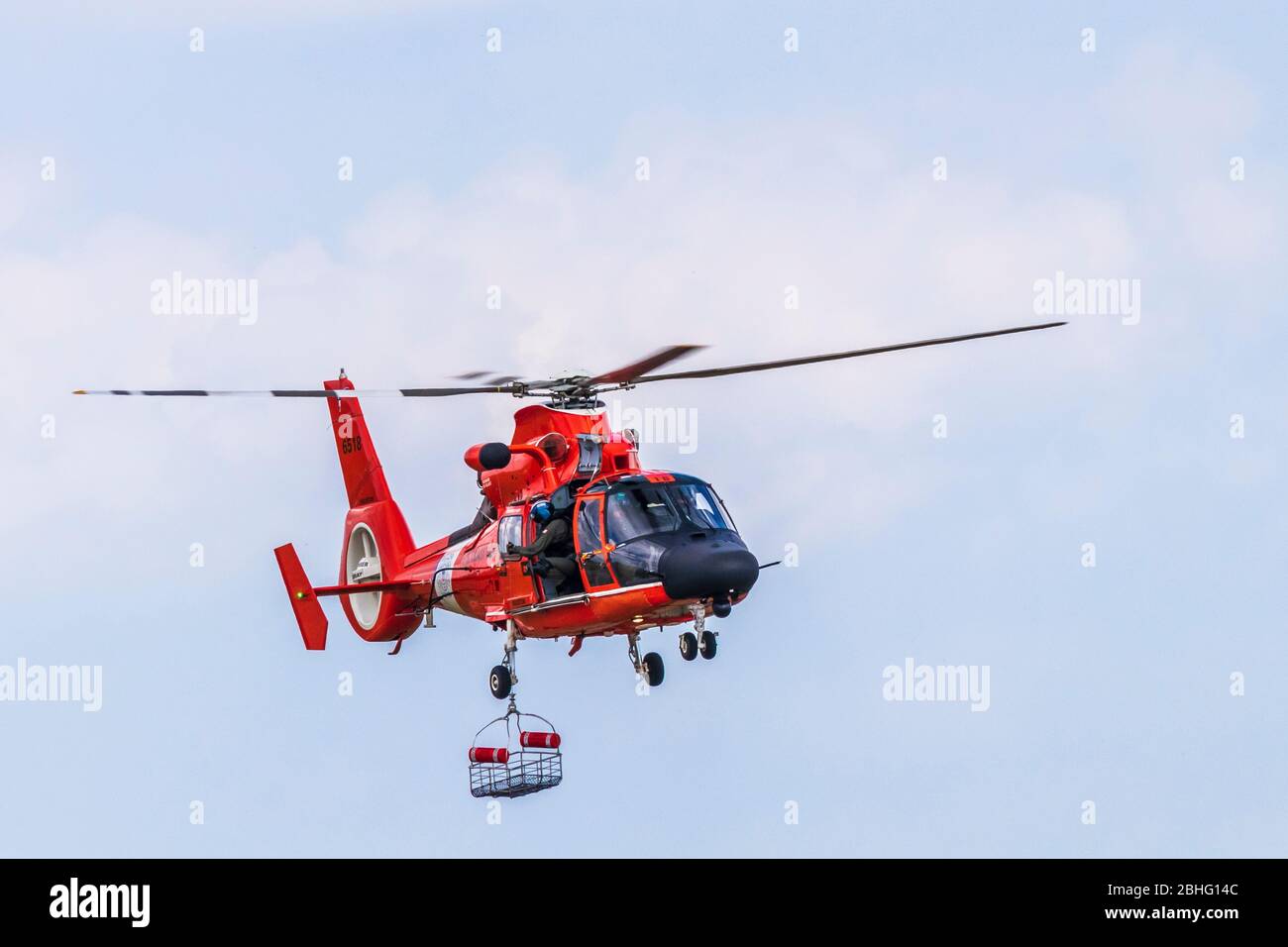 US Coast Guard MH-65 Dolphin Helicopter demonstrating rescue procedures at 2019 Wings Over Houston at Ellington Field in Houston, Texas. Stock Photo