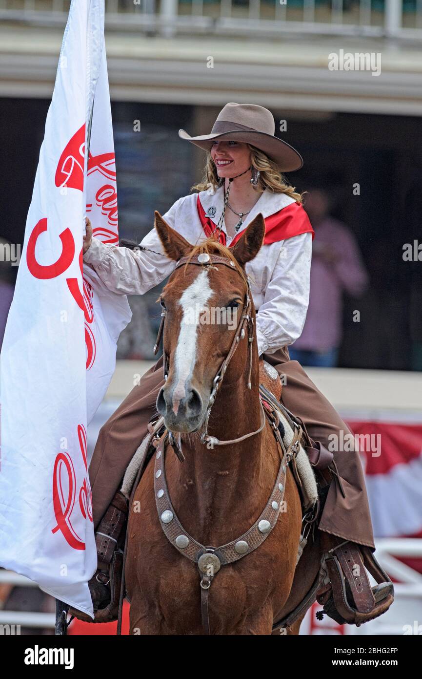 A cowgirl at the Opening Ceremonies starts each rodeo day at the Calgary Stampede Rodeo Alberta Canada Stock Photo