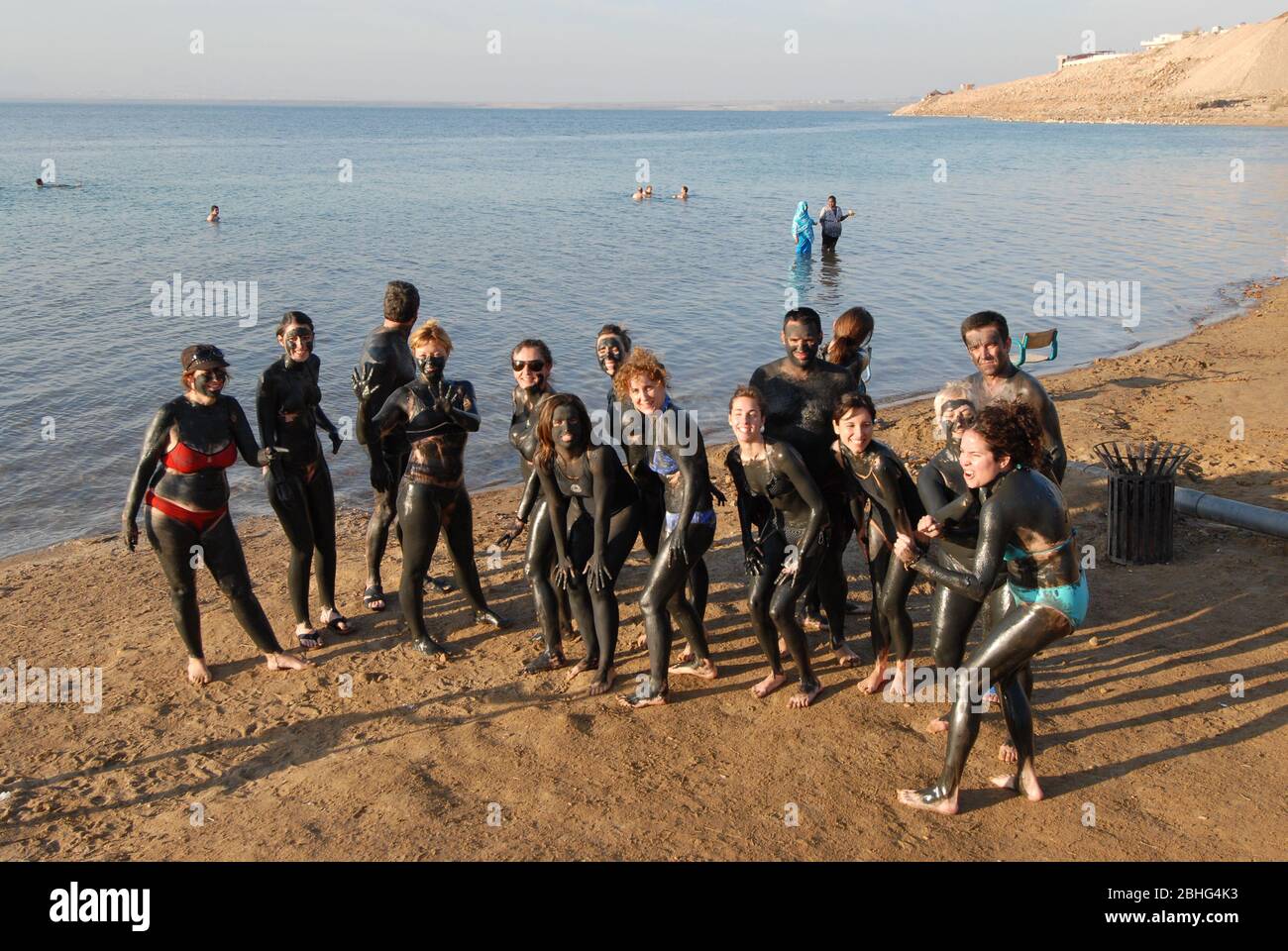 Dead sea, Jordan January 2010 Group of tourists covered of the dead