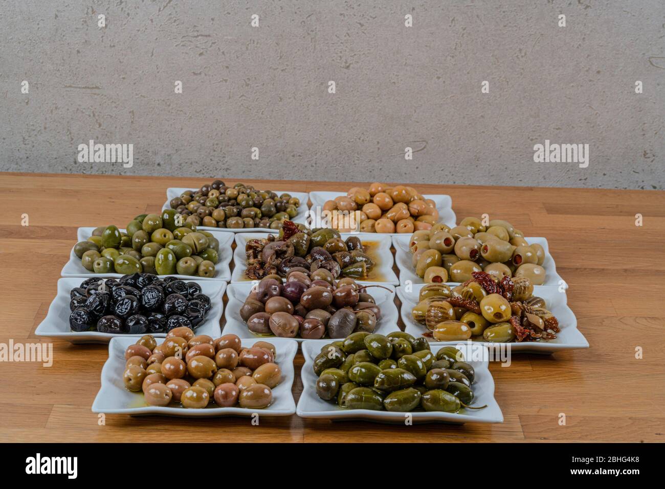 Olives assortment in bowl with oil. Stock Photo