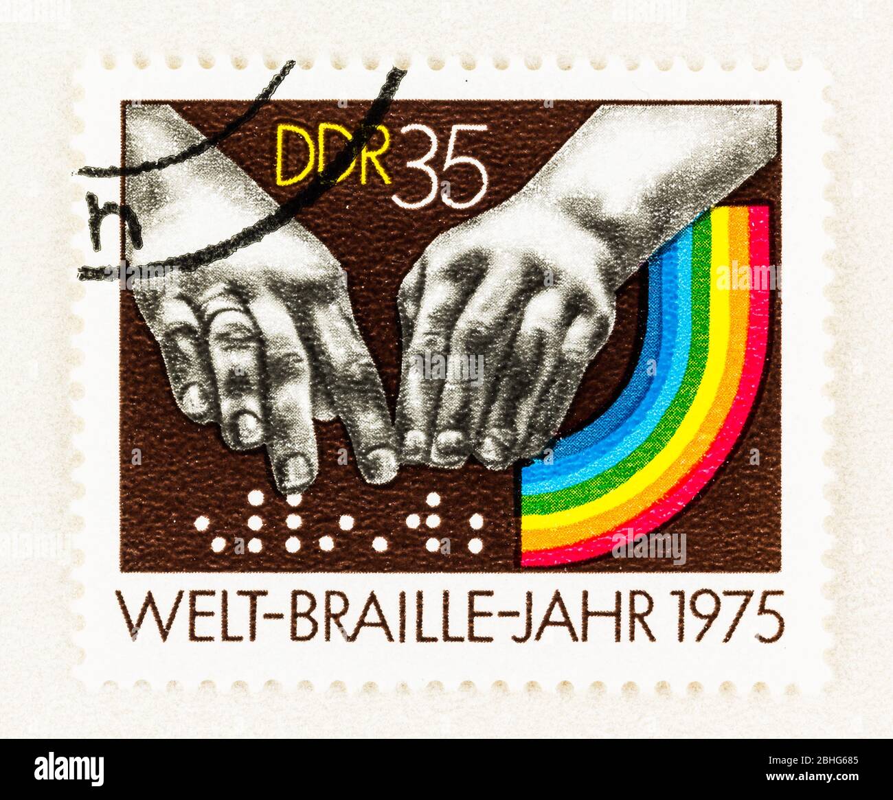 SEATTLE WASHINGTON - April 25, 2020: Postage featuring fingers reading braille and rainbow commemorating 1975 International Braille Year. Scott # 1691 Stock Photo