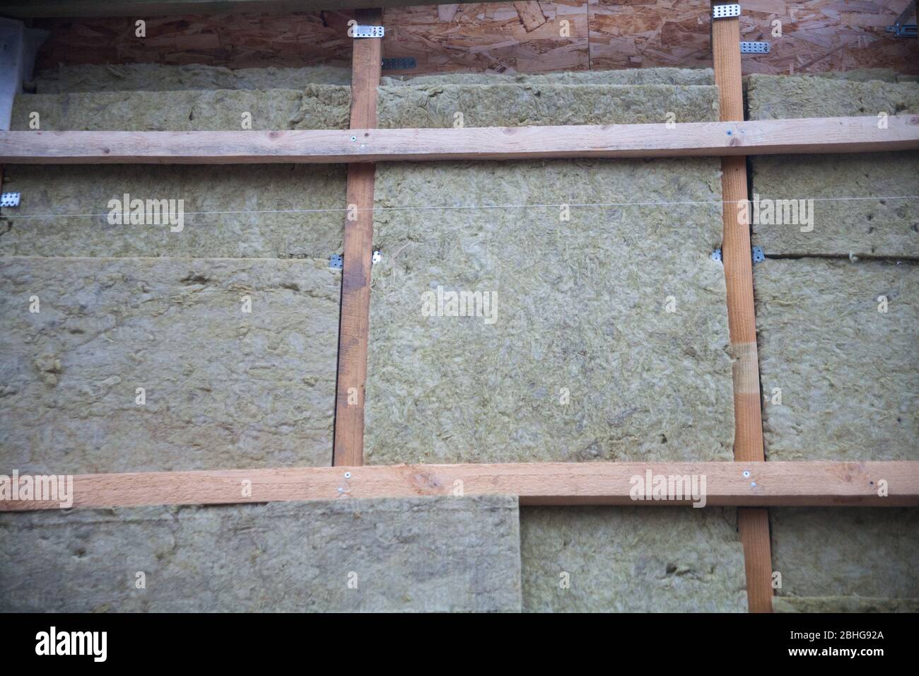 warming the walls of a stone house with a stone wool heater. Ecological