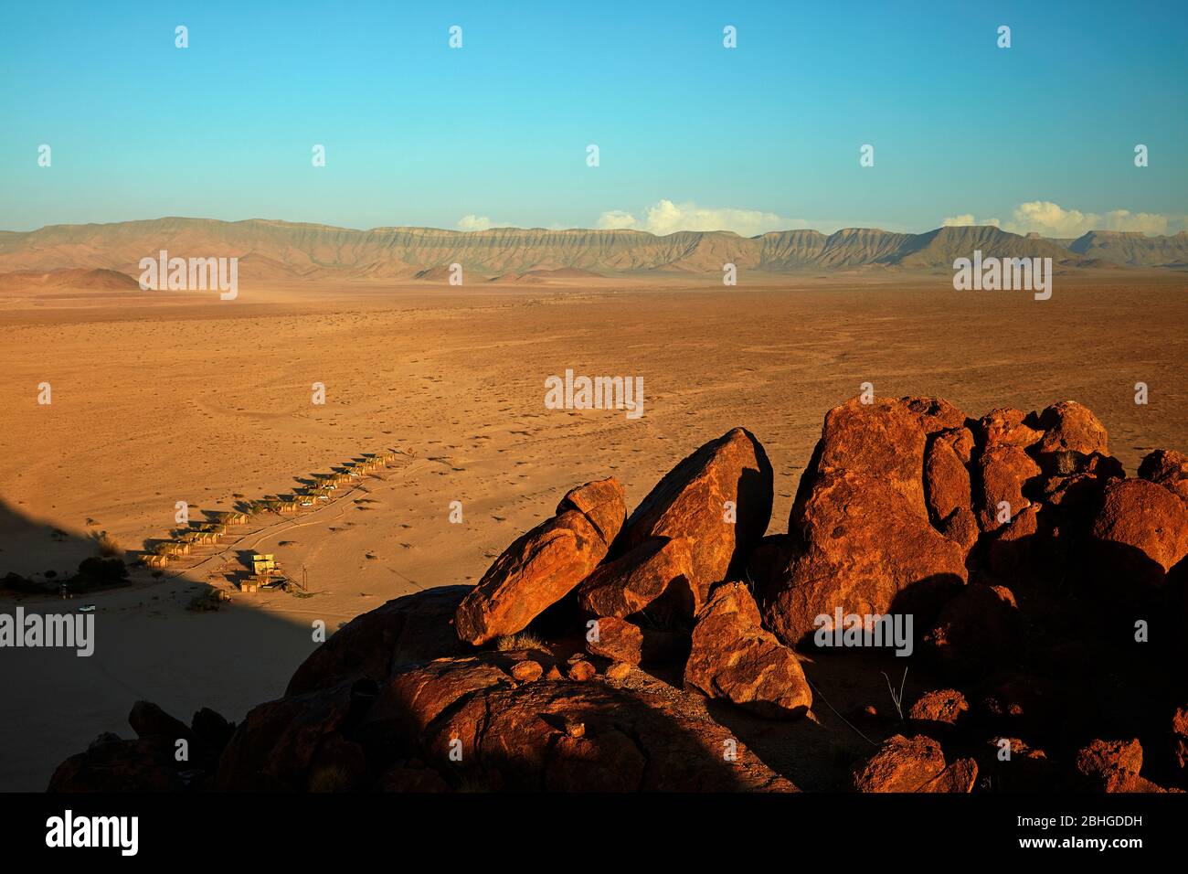 View of mountains and Desert Camp, from high on a rock koppie, Sesriem, Namib Desert, Namibia, Africa Stock Photo