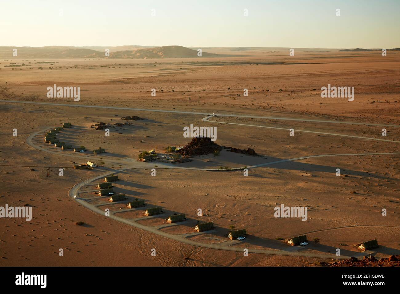 View of mountains and Desert Quiver Camp, from high on a rock koppie, Sesriem, Namib Desert, Namibia, Africa Stock Photo