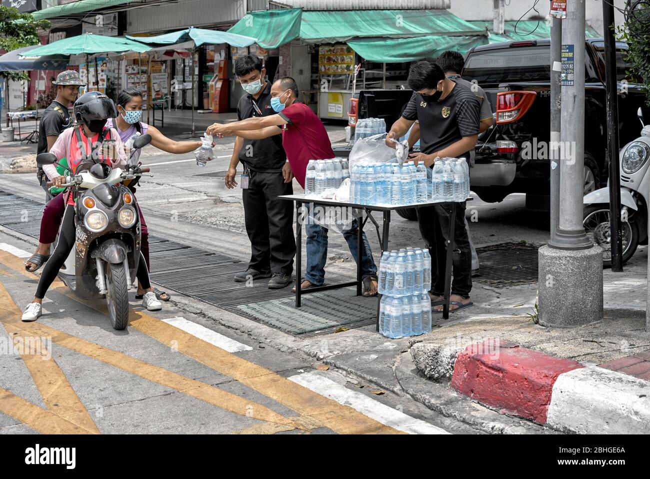 Covid-19. Free food and drink distributed for the Coronavirus financially affected poor and needy out of work people. Pattaya Thailand Southeast Asia Stock Photo