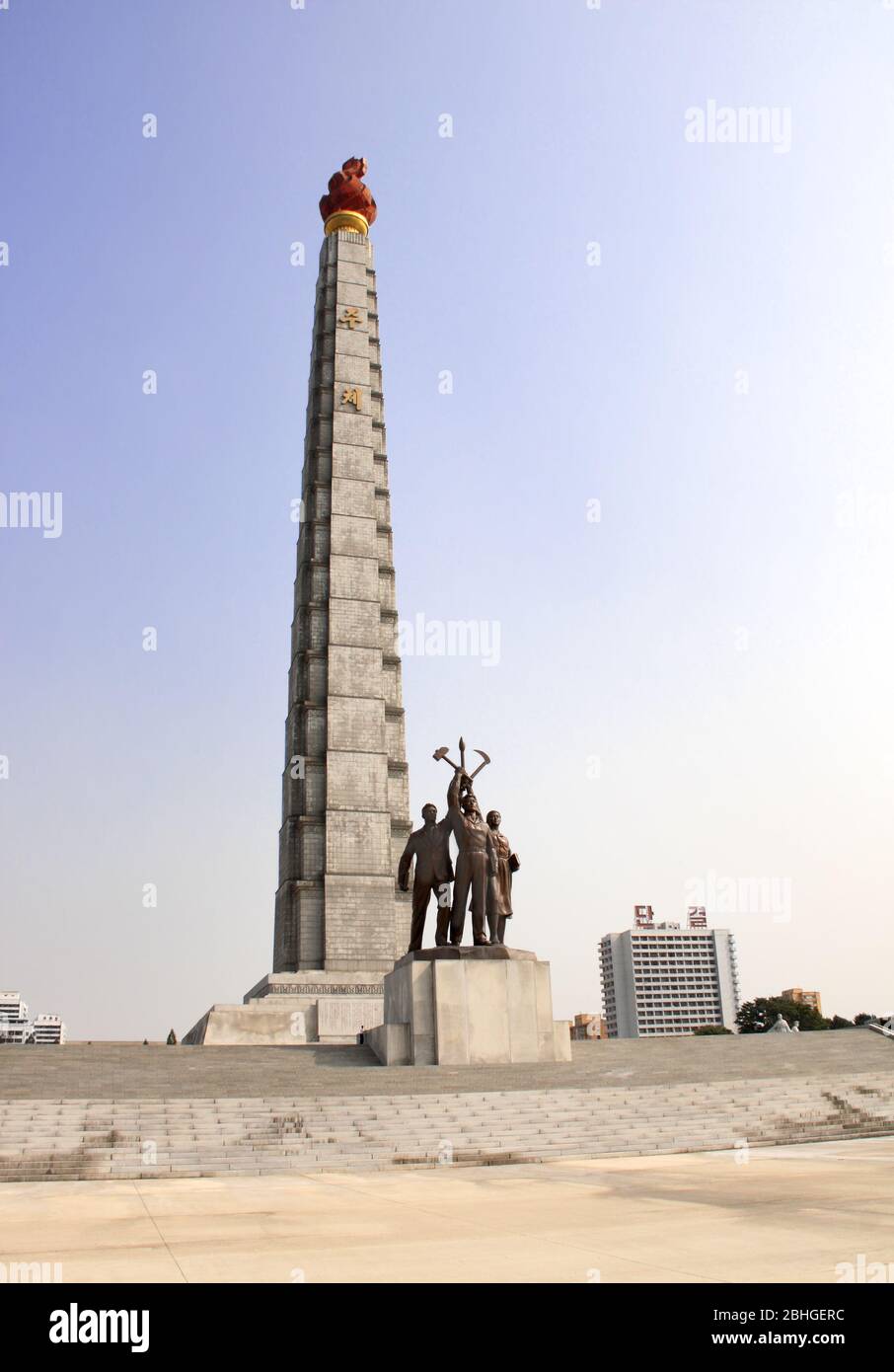 PYONGYANG, NORTH KOREA (DPRK) - SEPTEMBER 24, 2017: Tower of the Juche Idea and statues of people (worker, farmer and scientist) with korean national Stock Photo