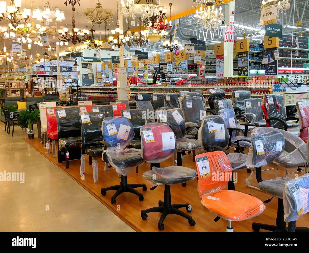 The many chairs for sale in Global House Hardware store in Thailand with a lot of Chandelier
