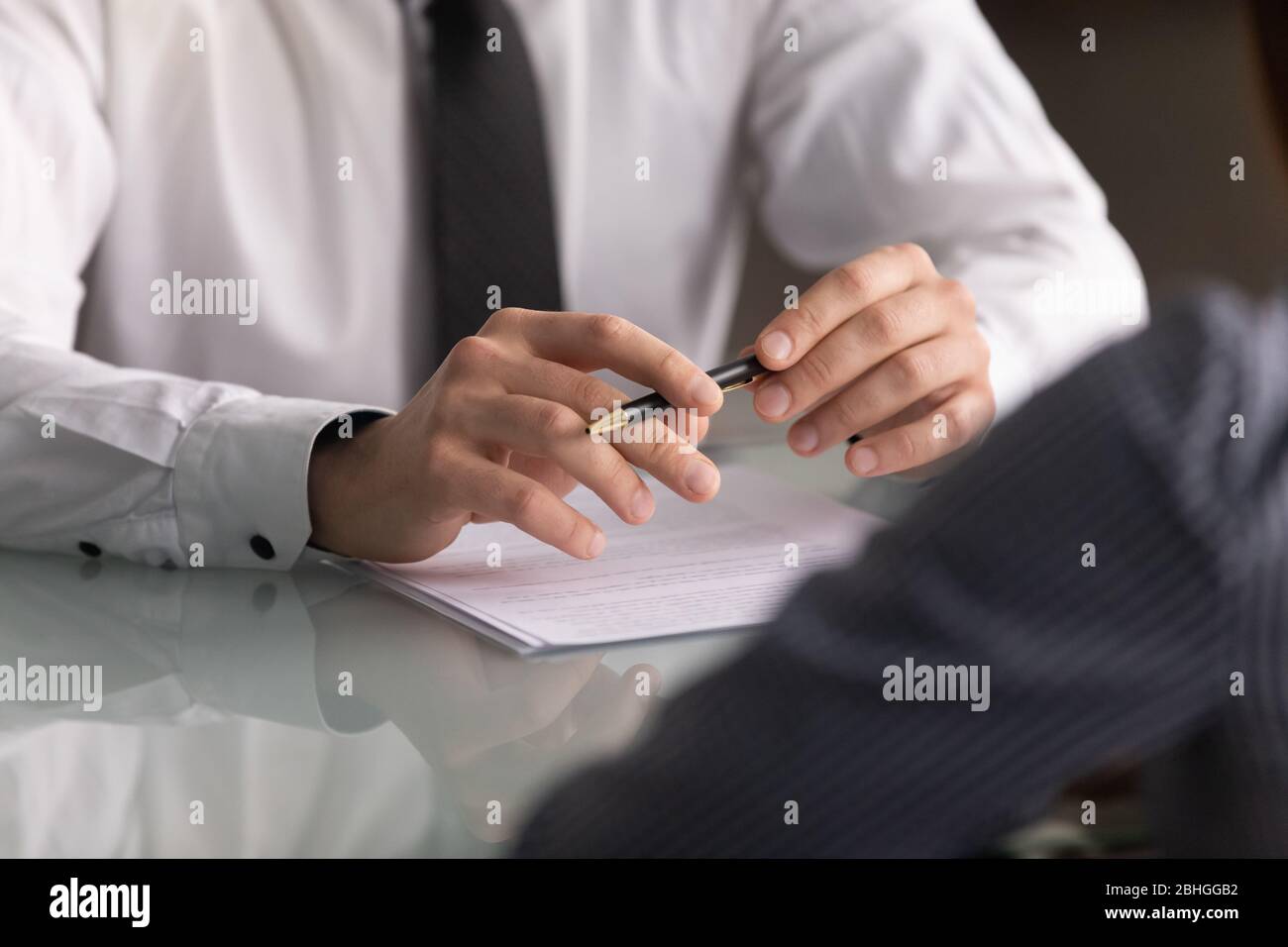 Close up businessman hands holding pen with document at meeting Stock ...