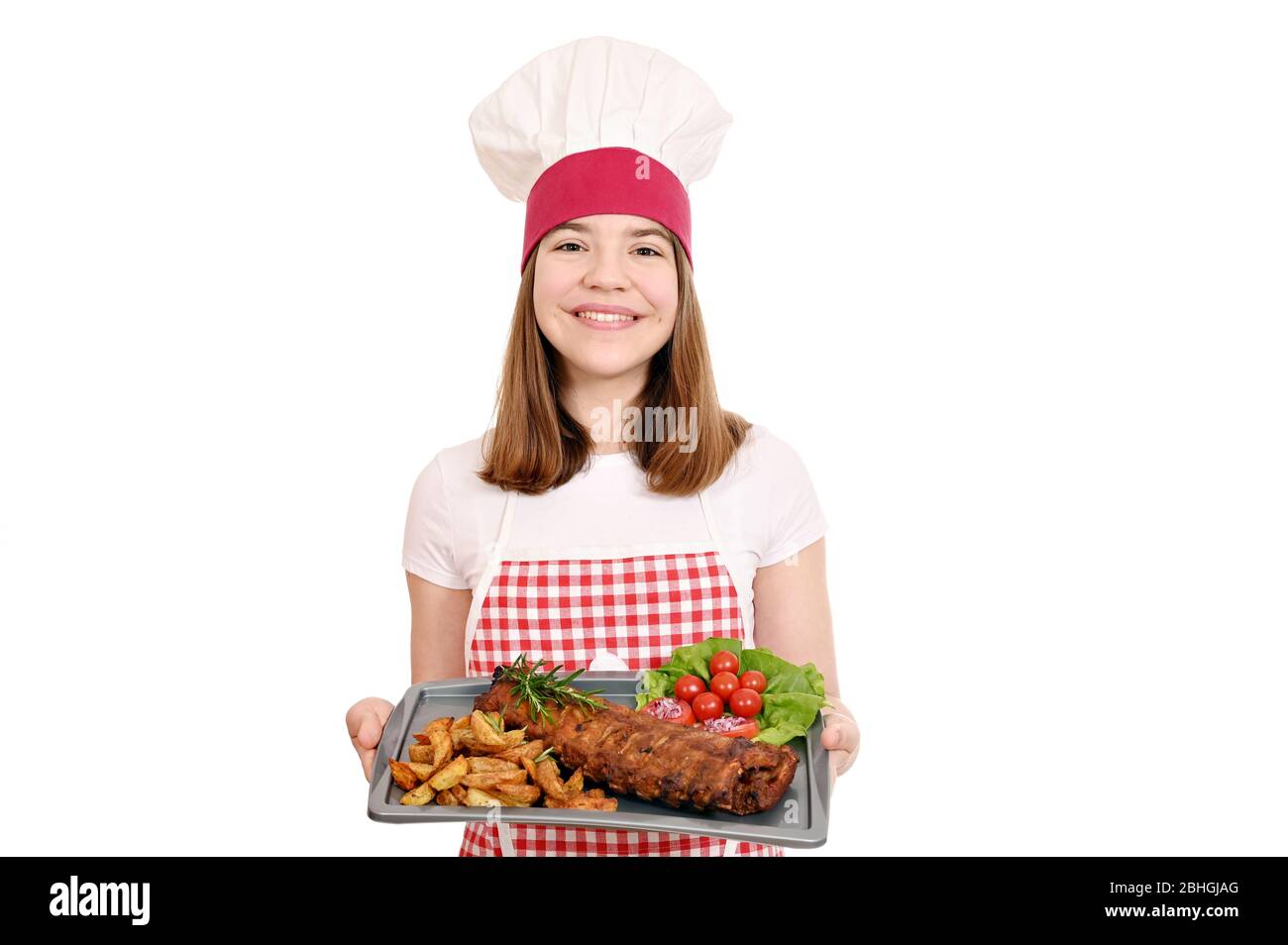 cook with pork ribs at plate Stock Photo