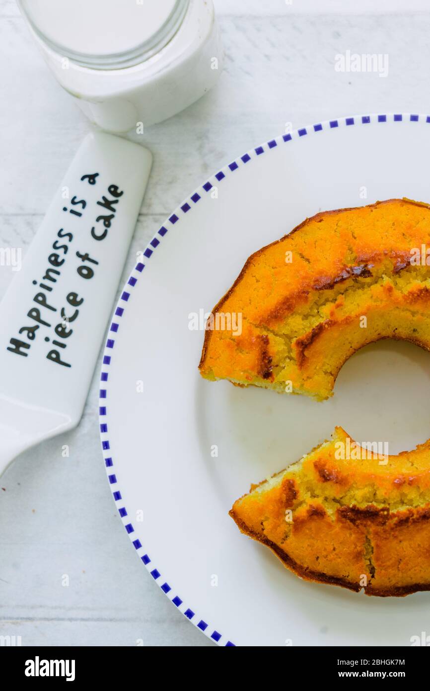 Organic corn cake and white plate on white wooden table Stock Photo