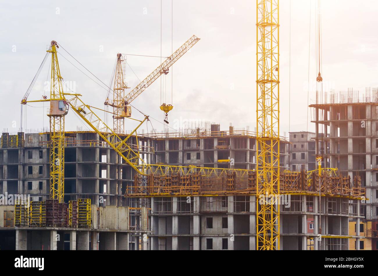 Construction of houses cranes crash crane crash on the building Stock Construction of houses cranes crash crane crash on the building Stock