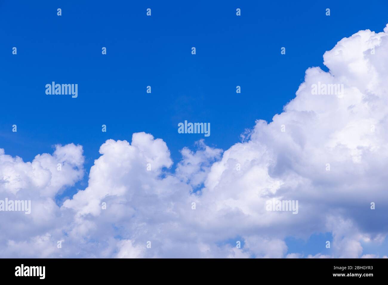 Blue sky background with white clouds on sunny day Stock Photo - Alamy