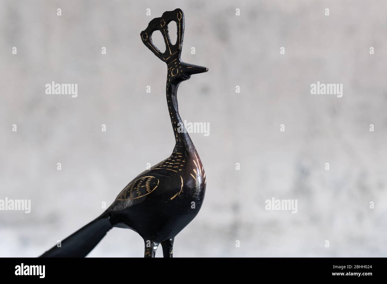 black color metal Peacock sculpture on white background Stock Photo
