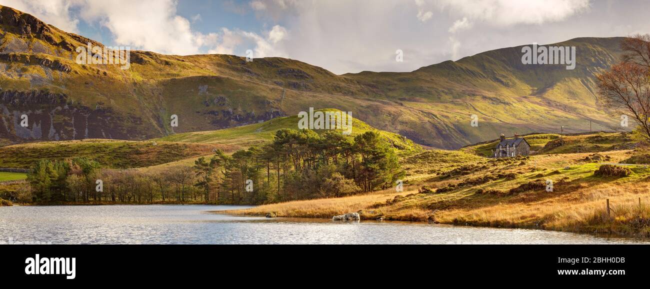 Small farmstead below Cadair Idris at the edge of Llynnau Cregennen in Snowdonia national park. Stock Photo