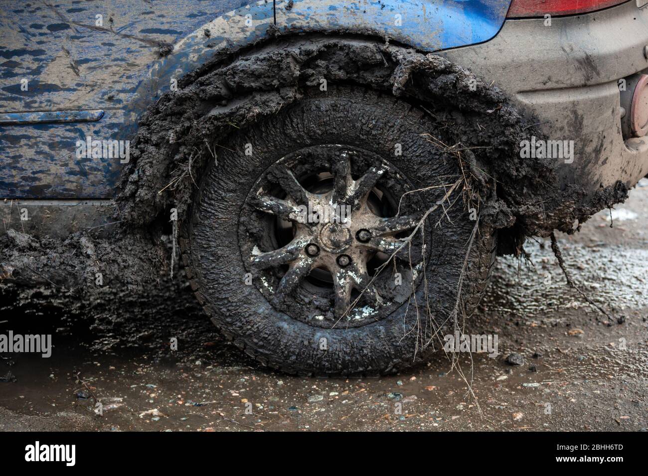 Front view of rear wheel stuck with mud in inner fender Stock Photo Alamy