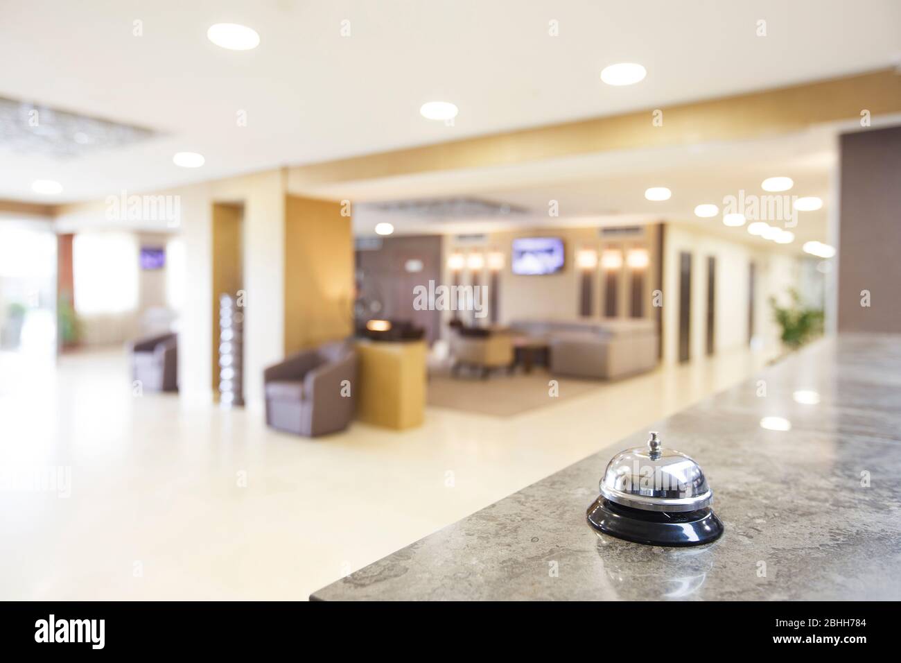 Hotel reception counter desk with service bell Stock Photo Alamy