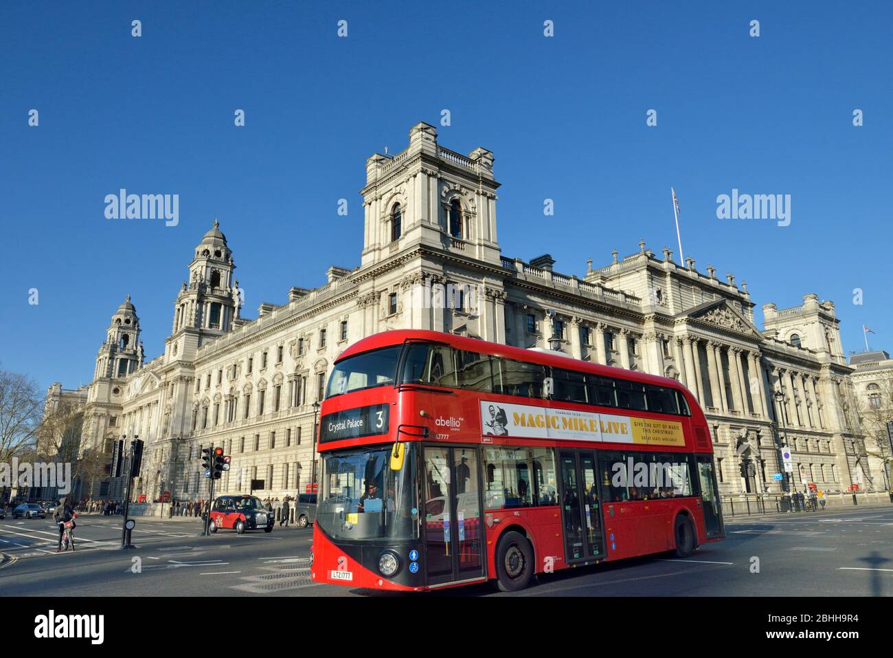 Red Bus in Parliament Square, Parliament Street, Whitehall, Westminster, London, United Kingdom Stock Photo