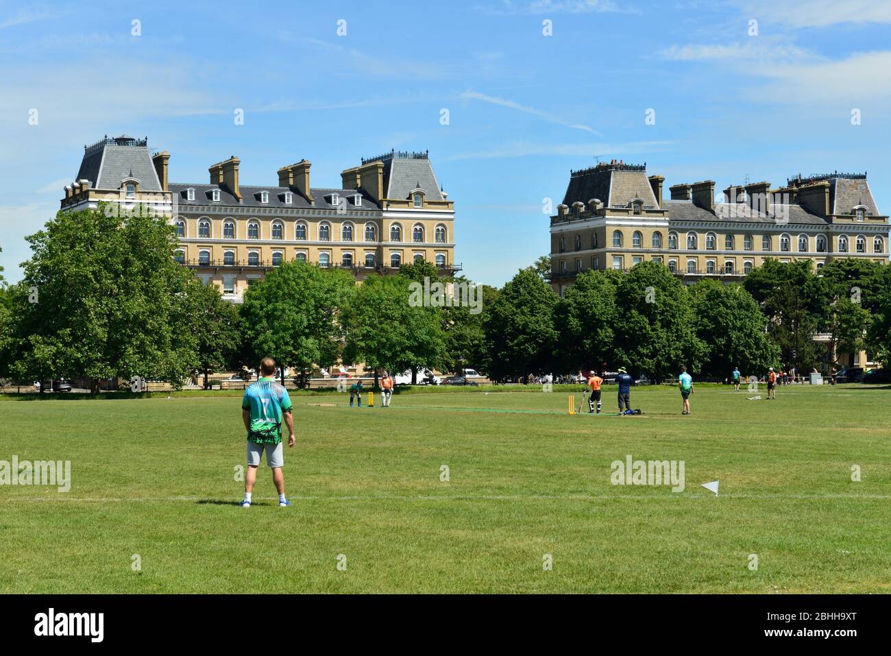 cricket on Clapham Common playing fields, Clapham Common North Side, London, United Kingdom Stock Photo
