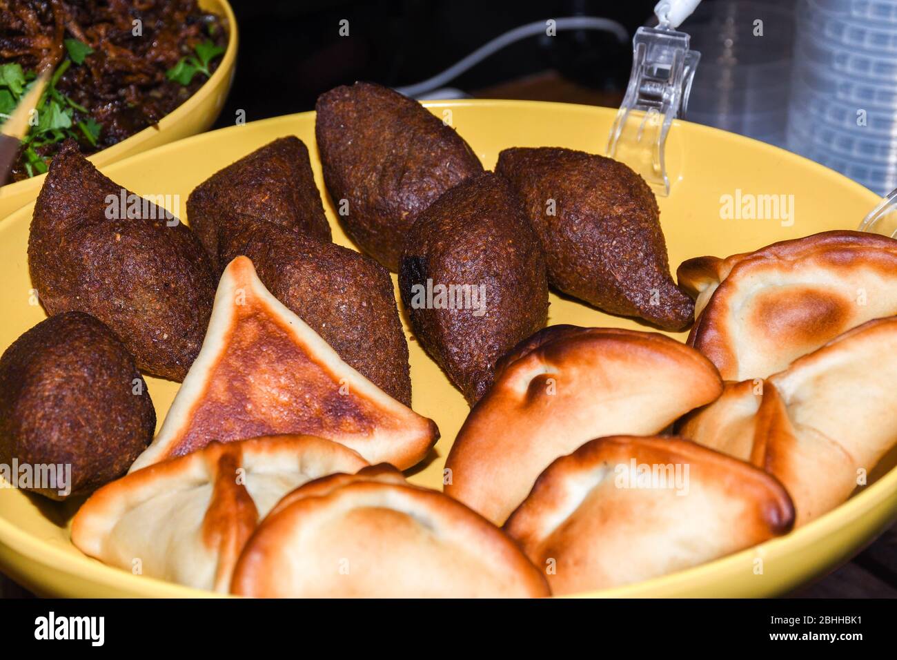 Kibbeh, also kubba and other spellings, is a Levantine dish made of bulgur, minced onions, and finely ground lean beef, lamb, goat, or camel meat with Stock Photo