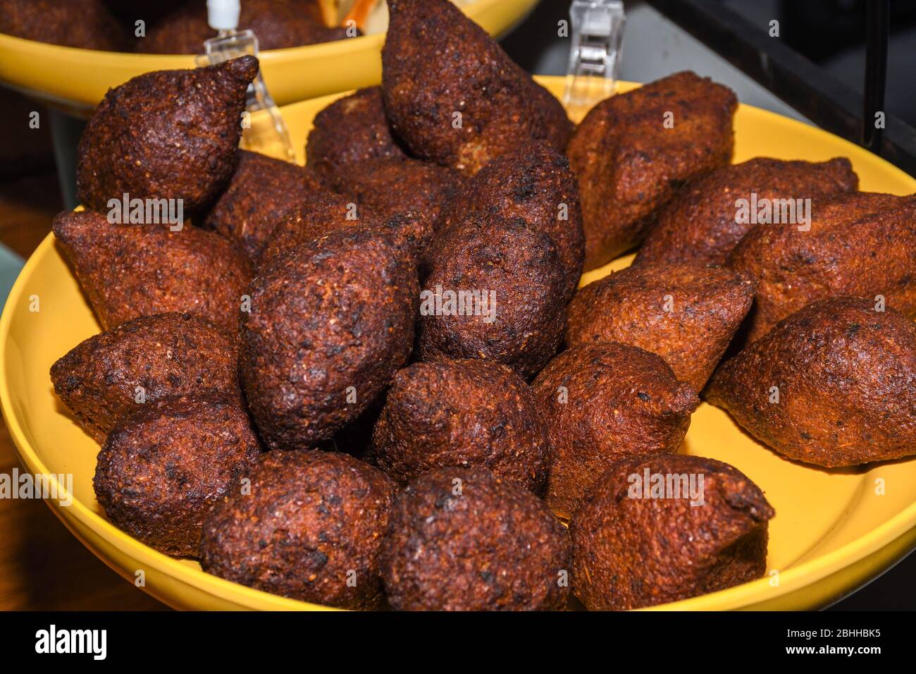 Kibbeh, also kubba and other spellings, is a Levantine dish made of bulgur, minced onions, and finely ground lean beef, lamb, goat, or camel meat with Stock Photo