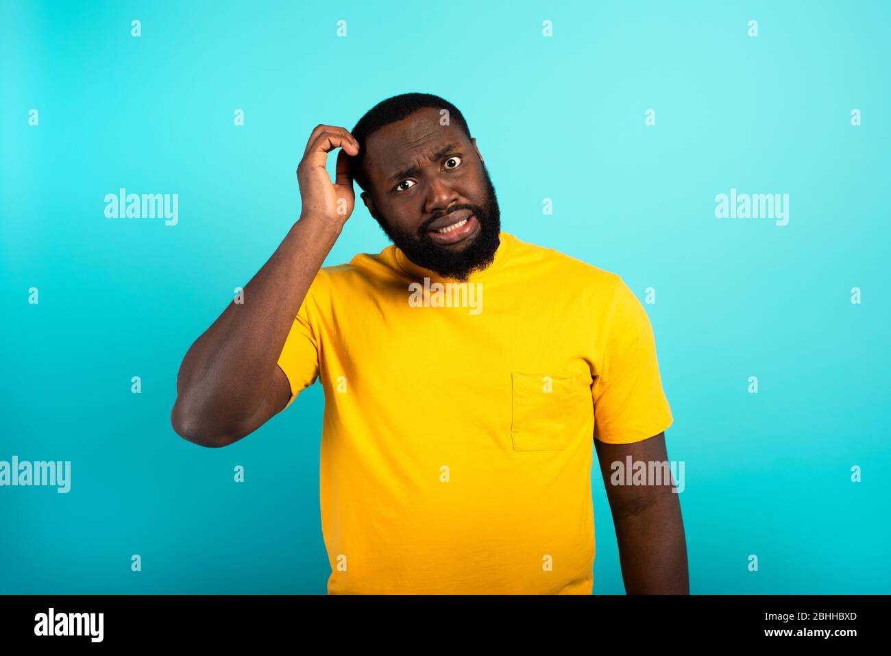 Confused Man have to choose something. Concept of options, confusion, decision. Stock Photo