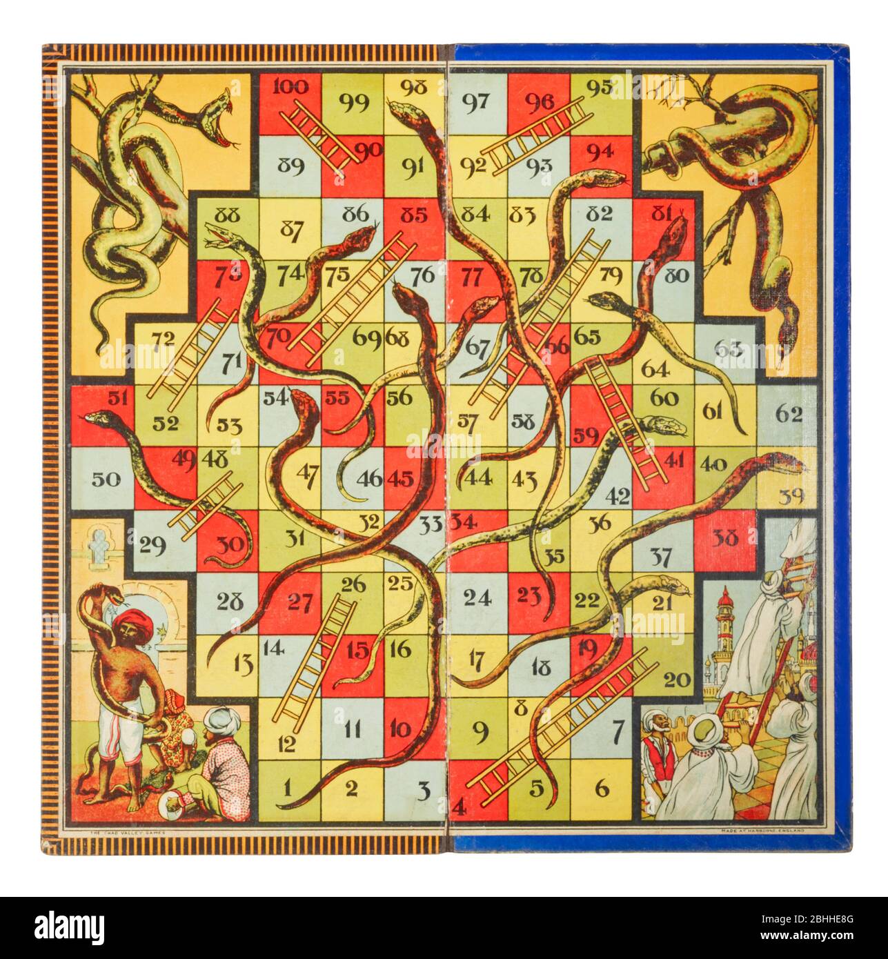 Inside of historical snakes and ladders board game with Indian themed illustrations Stock Photo