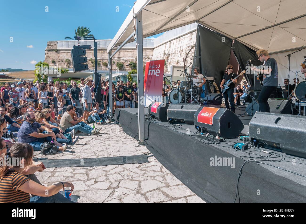 Palma de Mallorca, Spain; 10/04/2014: celebration of Music Day by Radio 3. On stage the musical group L.A. with public in the sun Stock Photo