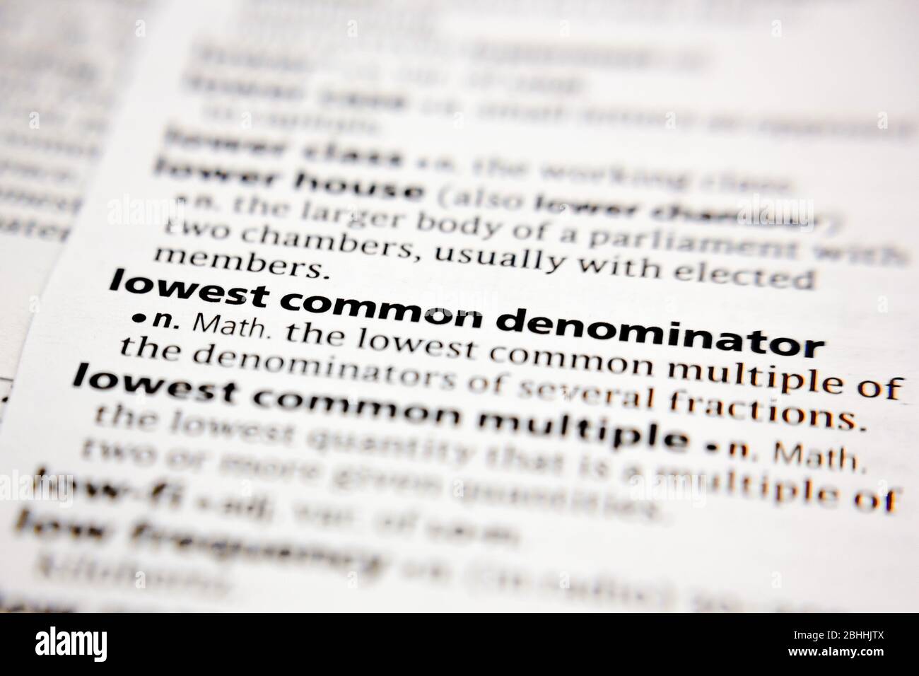 Word or phrase lowest common denominator in a dictionary. Stock Photo