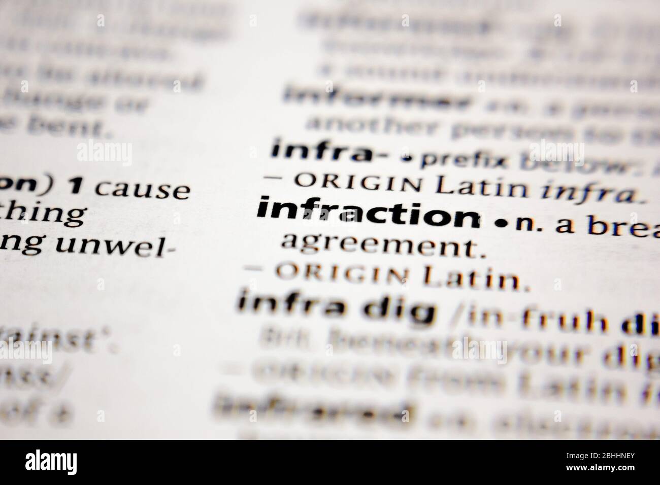 Word or phrase infraction in a dictionary. Stock Photo