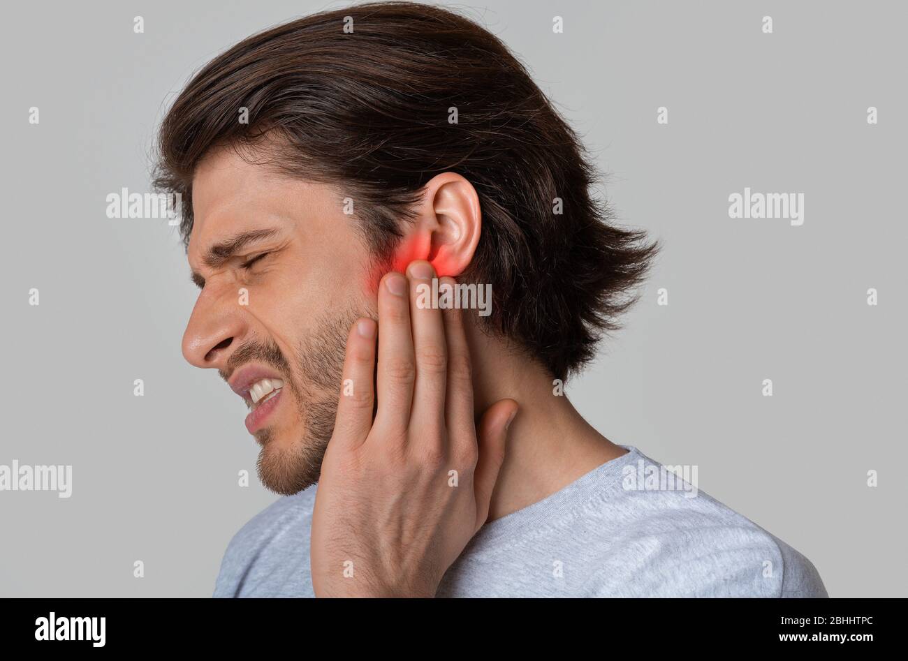 Red In Ear Highlighted in red pain in mans ear Stock Photo - Alamy