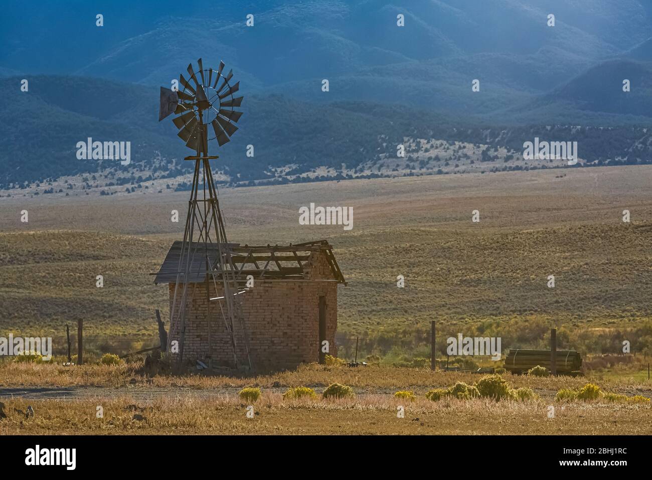 Old windmill pumping water in central Nevada, looking toward Toquima Range, USA {No property