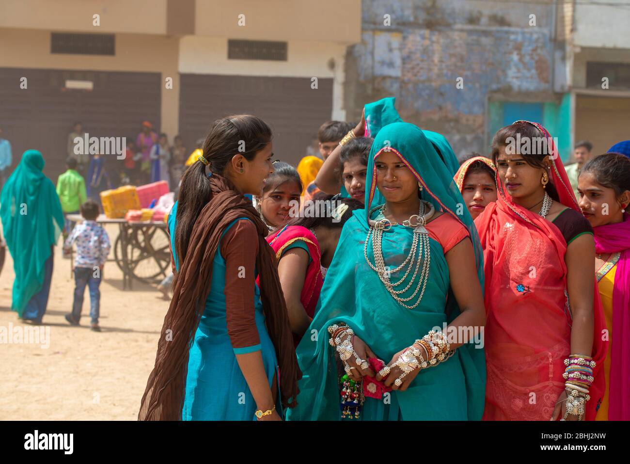 Alirajpur / India 9 March 2020 Bhil tribal women in traditional tribal dress going to attend at the annual Bhagoria fair in Alirajpur districts of Mad Stock Photo