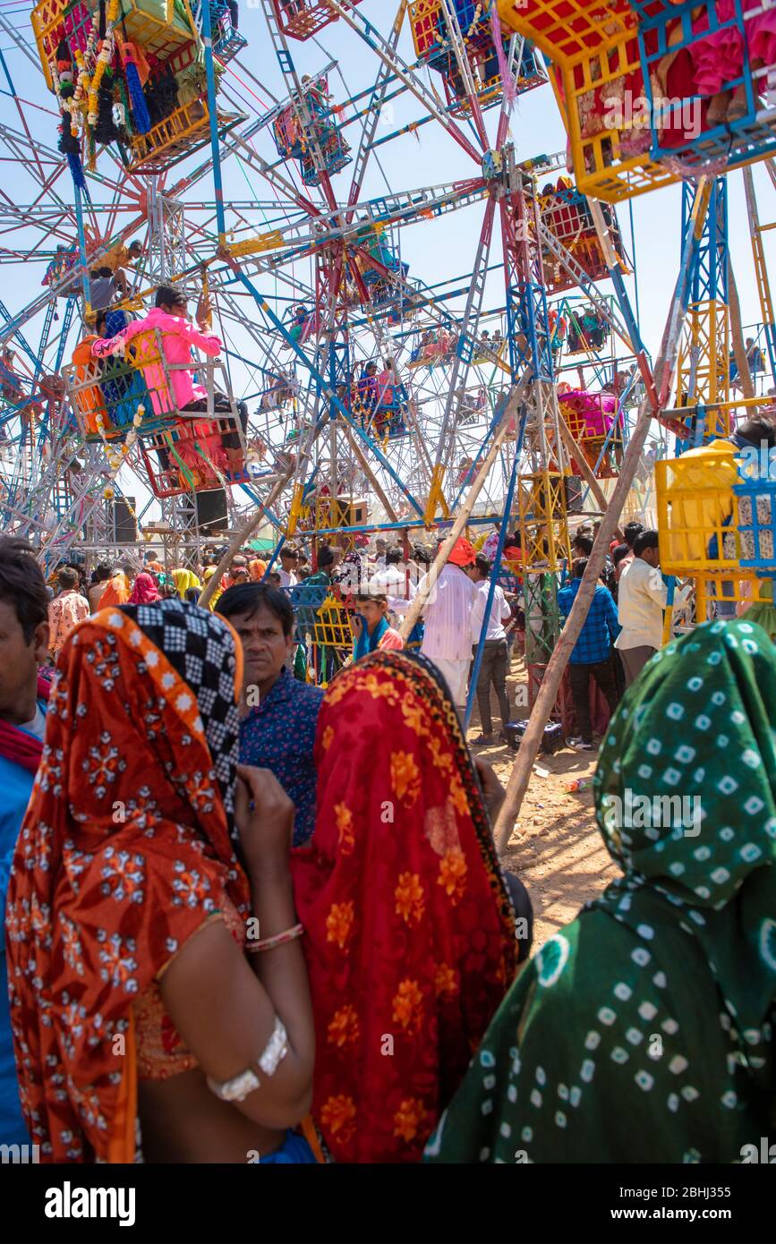 Jhabua  / India 8 January 2020 Tribal Women seeing a Ferris wheel during bhagoria festiva at Jhabua districts of Madhya Pradesh India Stock Photo