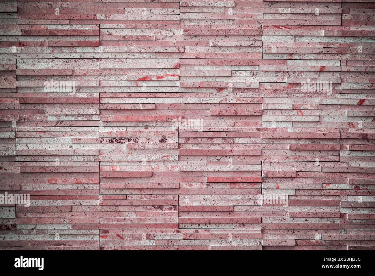 modern wall, reddish background with flecks and vignette. Stock Photo
