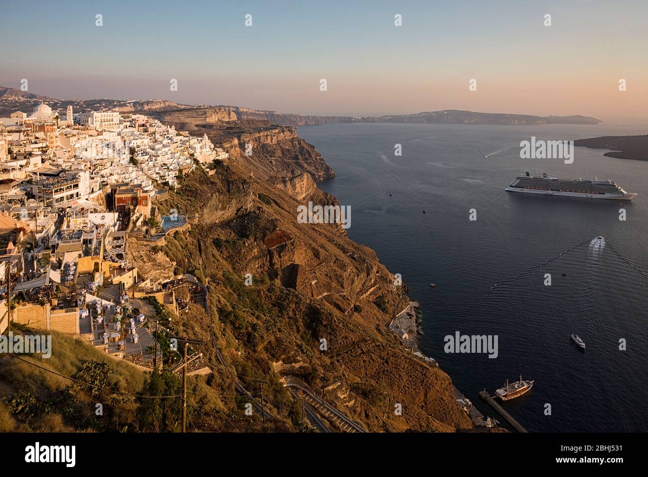 Elevated view of Oia at sunset, Santorini, Greece, Cyclades islands, Southern Europe Stock Photo